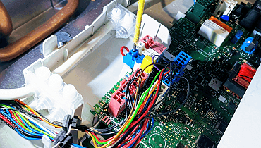 Vaillant boiler printed circuit board during repair